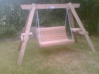 Custom built wooden garden swinging seat.